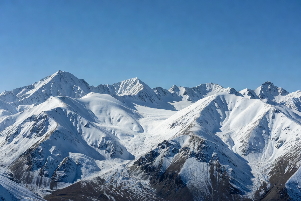 Snow-capped mountain range under a clear sky